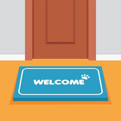 istock Doormat in front door. 1302331034