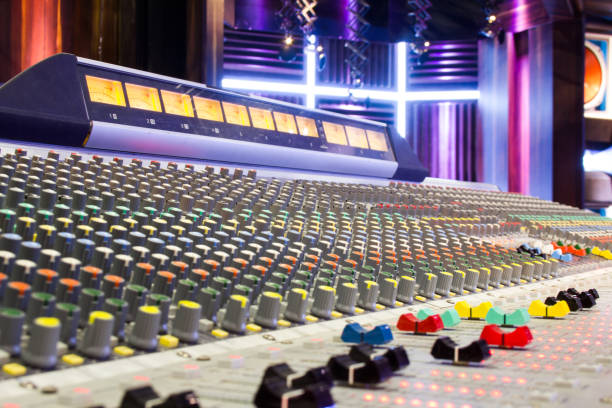 istock Audio mixing console with faders and adjusting knobs. Sound recording studio mixing desk. Professional sound concert equipment. 1302332309