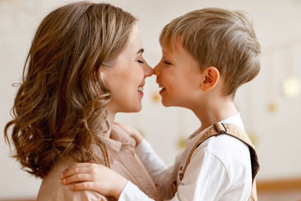 istock Mother and son hugging at home 1302336483