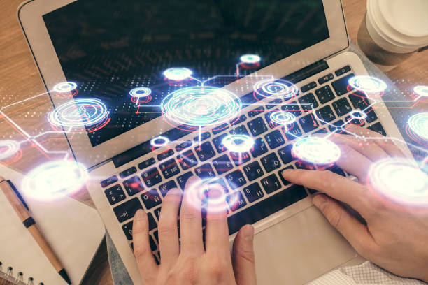 istock Double exposure of man's hands typing over computer keyboard and social network theme hologram drawing. Top view. People connection web concept. 1302336984