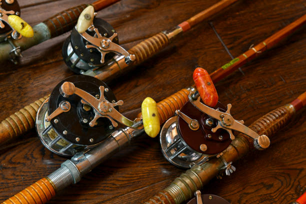 Vintage Bamboo Fishing Rods And Conventional Reels Stock Photo - Download  Image Now - Antique, Bamboo - Material, Brown - iStock