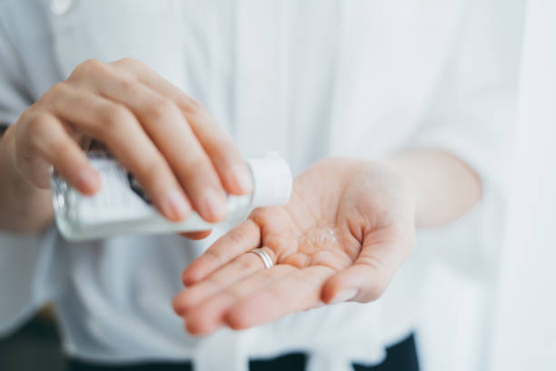istock Washing Hand with Alcohol Sanitizer 1302337759