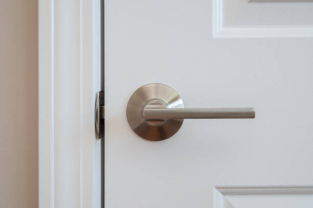 Nickel plated closet door lever Photograph of a modern styled nickel closet door lever doorknob stock pictures, royalty-free photos & images