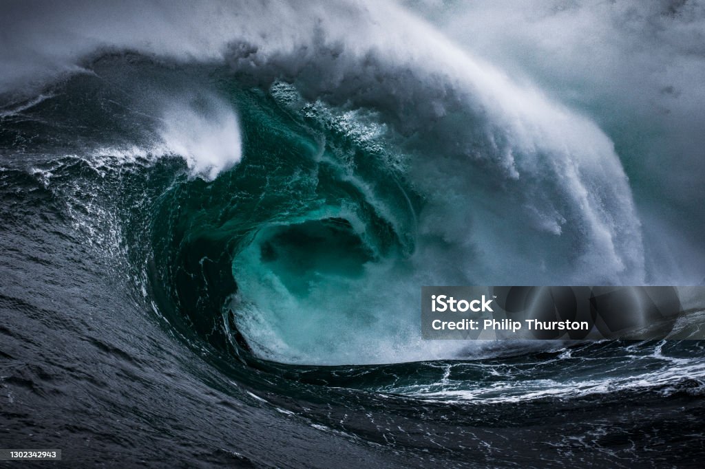 Dangerous powerful storm surge wave, dark and fearful provoking scene Storm Stock Photo