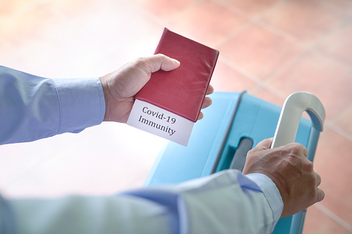 Traveler holding a passport with 