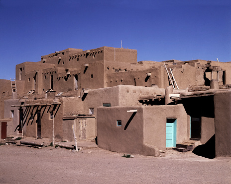 This pueblo is one of the oldest continuously inhabited in the country. The multi-storied abode complexes were built roughly 1,000 years ago. Inhabited bu Taos-speaking Native American tribe of the Puebloan people.