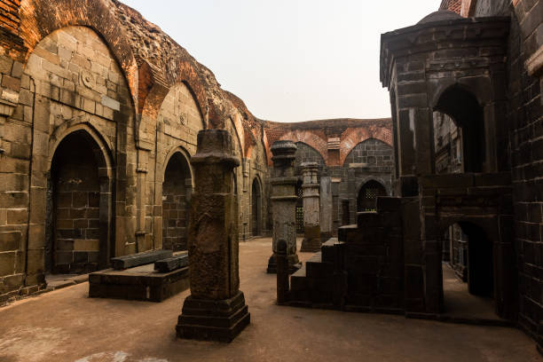 A Qutb Shahi mosque in Pandua A stone pulpit in a hall at the ruins of an ancient Qutb Shahi mosque in the village of Pandua near Malda in West Bengal, India. islamic architecture stock pictures, royalty-free photos & images