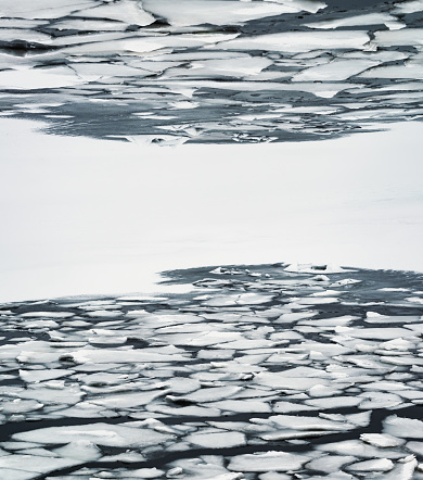 A layer of broken ice in a cove. Composite image with copy space.