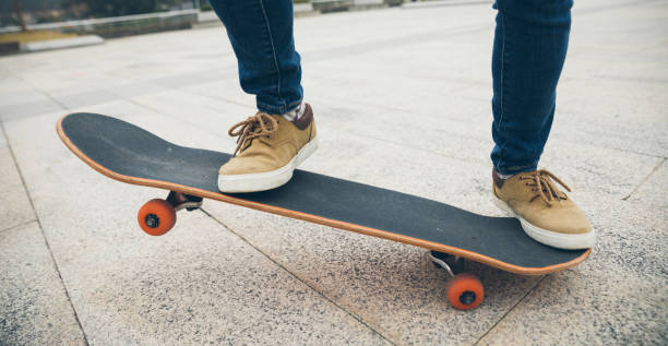 istock Skateboarder legs skateboarding at outdoors 1302347897