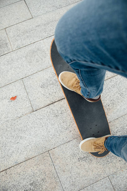 istock Skateboarder legs skateboarding at outdoors 1302348305
