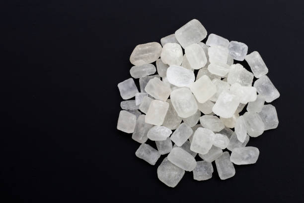 istock Crystal rock sugar on dark background. 1302350974