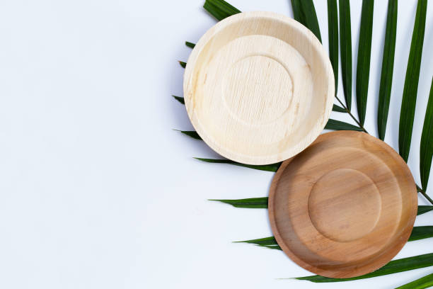 istock Betel palm leaf plates on white background. 1302351644
