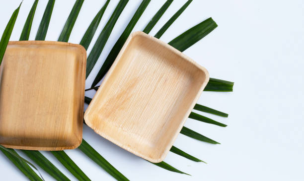 istock Betel palm leaf plates on white background. 1302351708