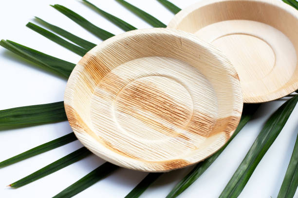 istock Betel palm leaf plates on white background. 1302351726