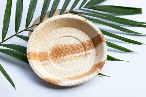 istock Betel palm leaf plates on white background. 1302351734