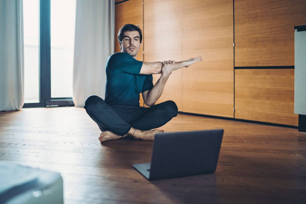 istock Man following online sports instructions 1302354416