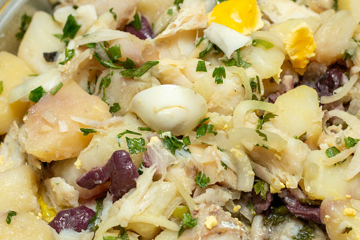 dish known as codfish food, containing codfish, onion, egg, potato and black olives, very popular in Brazil.