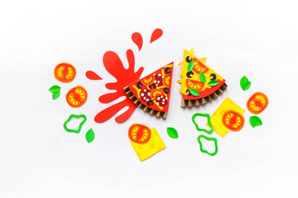 Paper craft pizza. Sauce spilled on a white background ketchup. Children's creativity hobbies
