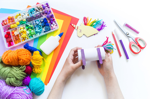 Unicorn cardboard and paper craft. Children's hands do. How to entertain a child. Kindergarten and school