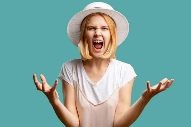 istock furious woman feeling rage angry screaming lady 1302356773