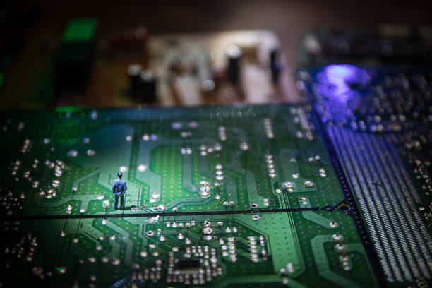 istock Stylized photo of an electronic microcircuit. Microcircuit, contacts, electronics, motherboard. Black background. Macro photography of electronic devices. 1302358489