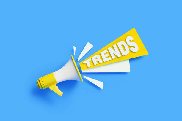 istock Trends Coming Out From Yellow Megaphone On Blue Background - Trends Concept 1302359301