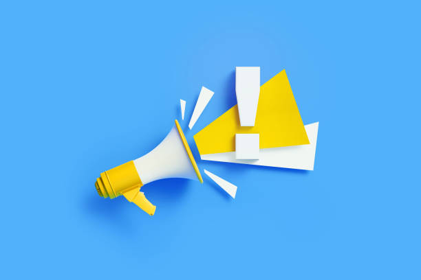 istock Exclamation Point Coming Out From Yellow Megaphone On Blue Background 1302360085