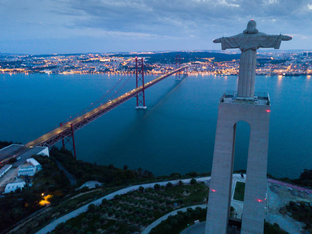 istock Lisbon and 25 de Abril Bridge early in morning 1302361104