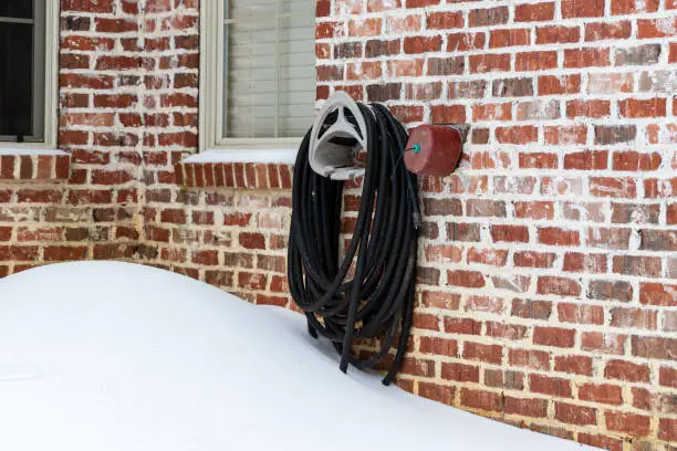 Photo of Faucet cover installed on water faucet to protect it from freezing