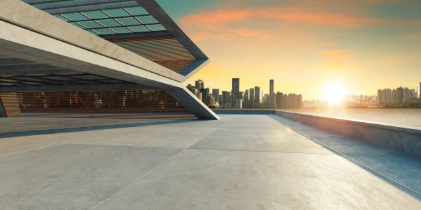 istock Concrete floor and modern building exterior 1302368537