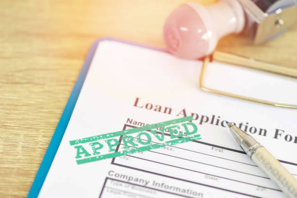 Loan approval, Loan application form with Rubber stamping that says Loan Approved, Financial loan money contract agreement company credit or person. Loan approval, Loan application form with Rubber stamping that says Loan Approved, Financial loan money contract agreement company credit or person financial loan stock pictures, royalty-free photos & images