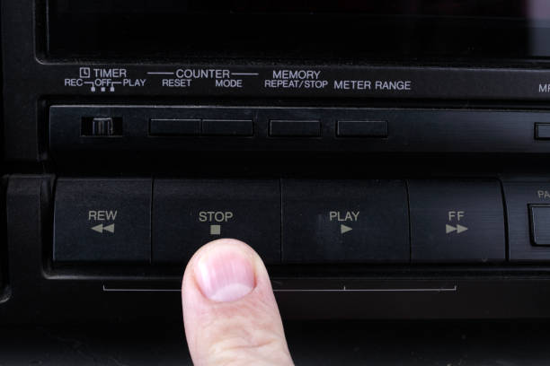 istock Press stop button on retro audio cassette tape recorder. 1302373903