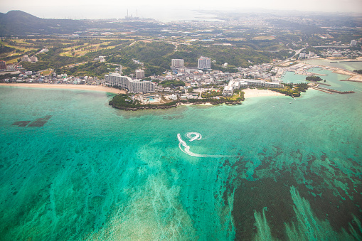 An aerial view of Onna village in central Okinawa. Popular tourist destination with its beautiful beaches and many resorts and hotels.