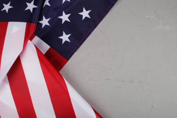 istock USA state flag on concrete background, place for text 1302374964