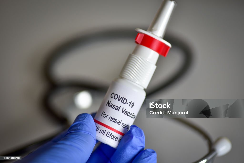 Coronavirus COVID-19 nasal vaccine A fictional covid-19 nasal vaccine vial. The vial is created for photography purpose only. Nasal Spray Stock Photo