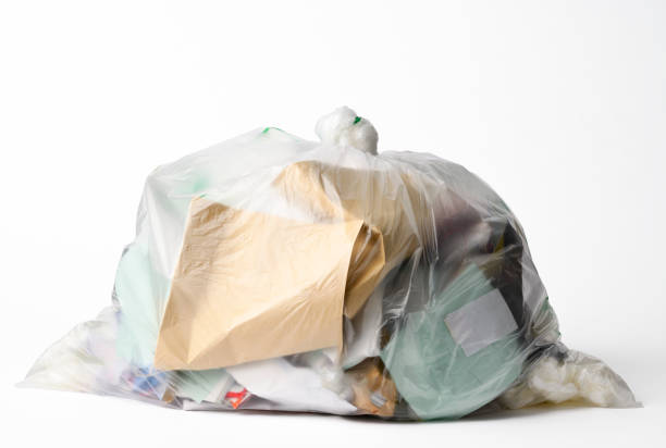 Closed translucent garbage bag, isolated on white with clipping path.