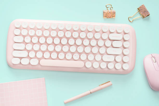 istock flat lay pink color computer and stationery 1302382257