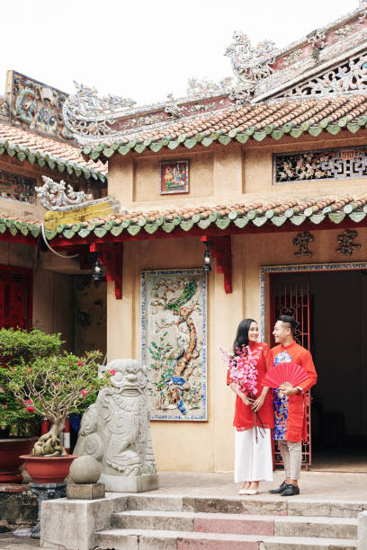 istock Couple leaving Buddhist temple 1302382444