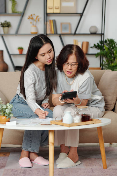 istock Calculating household expenses 1302382663