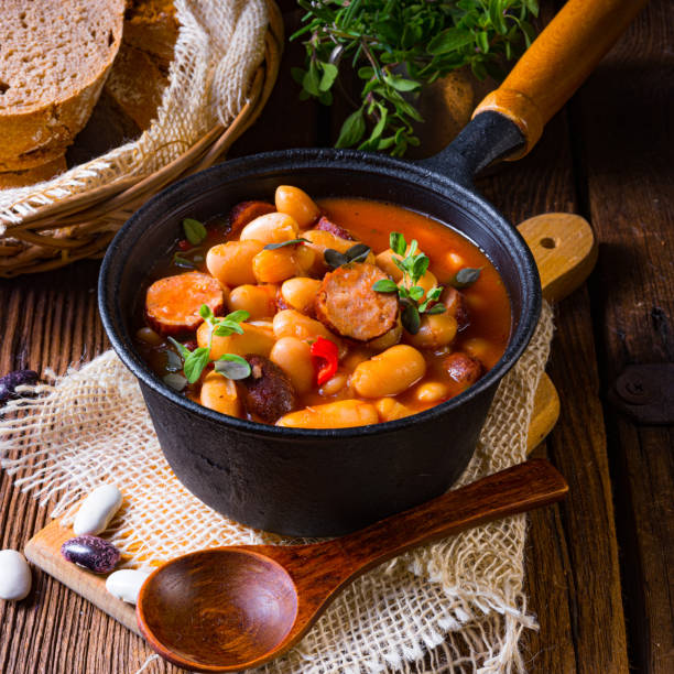 istock Delicious bean stew with sausage and potato 1302383294