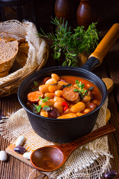 istock Delicious bean stew with sausage and potato 1302383321