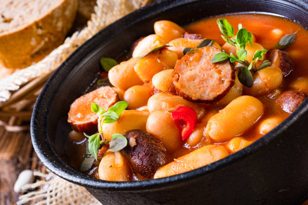 istock Delicious bean stew with sausage and potato 1302383409