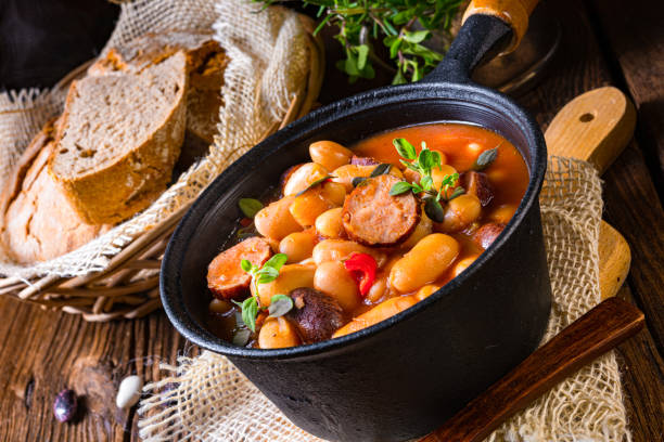 istock Delicious bean stew with sausage and potato 1302383427