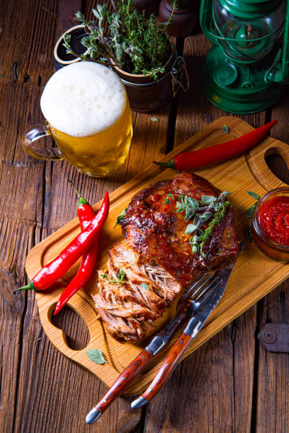istock Pulled pork out of the oven with beer sauce 1302384342