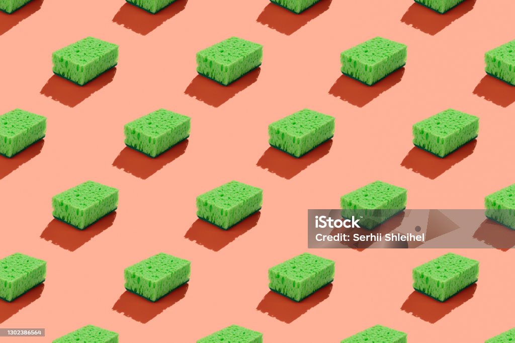 Green washing sponge isolated on red background seamless pattern Green washing sponge isolated on red background seamless pattern. Greenwashing Stock Photo