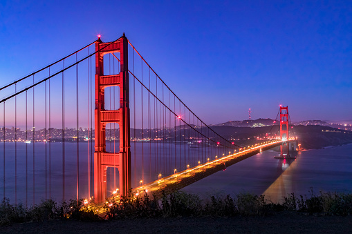 The Golden Gate, suspension bridge spanning the strait of the same name, is seen just before dawn from Battery Spencer, an old gun emplacement on the Marin Headlands that protected from enemy invasion in years past.