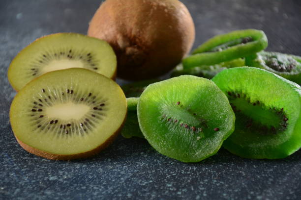 istock Sliced kiwi fruit  in pieces  fresh and dried 1302391044