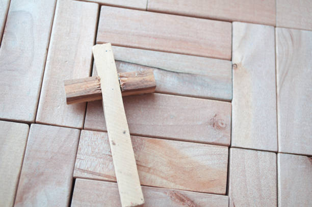 Wooden cross on brick wall of church in Helsinki, Finland