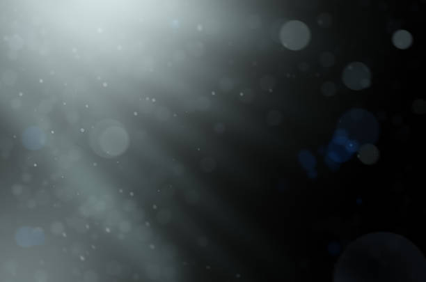 istock particles in a blur on a black background 1302392404