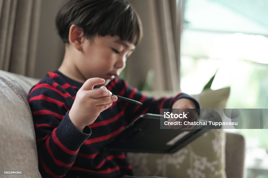 Child Using Smart Pen Child Boy Using Pen Drawing Digital Tablet Stock Photo - Download Image ...